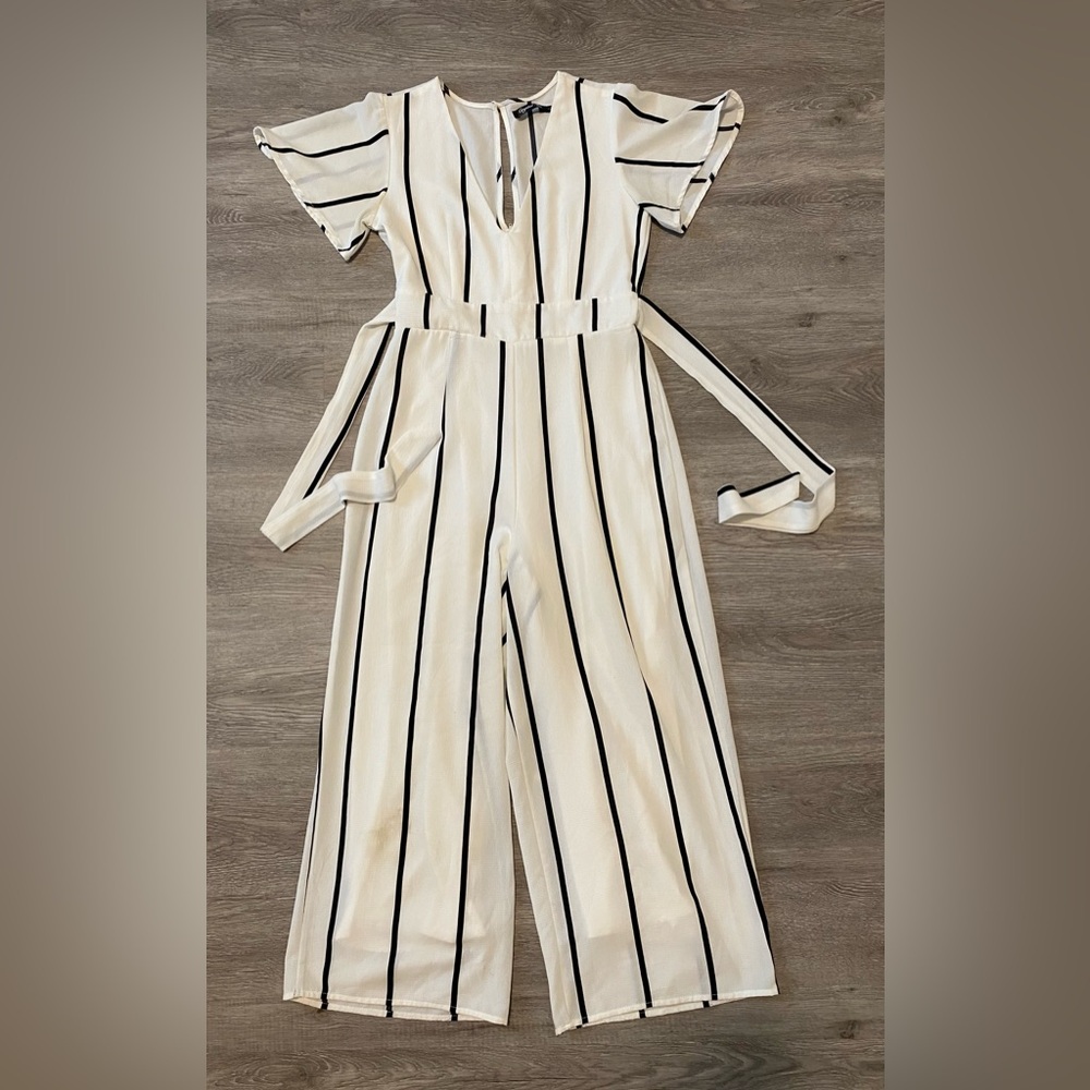 White jumpsuit with black stripes